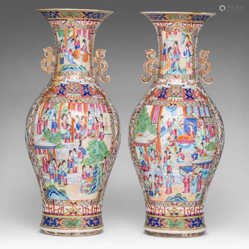 A pair of Chinese Canton famille rose vases, paired with dra...