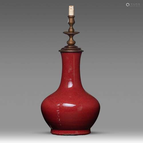 A Chinese sang-de-boeuf glazed bottle vase, with lamp mounts...