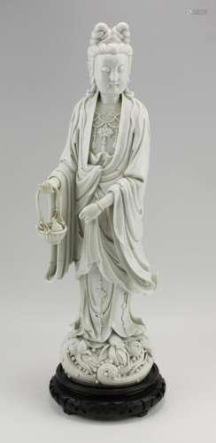 A large blanc-de-chine figure of a standing Guanyin