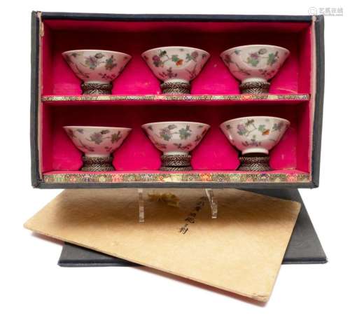 Six famille rose bowls in a fitted box