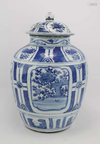 A large blue and white covered vase