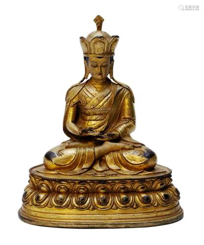 A bronze gilt crowned Lama