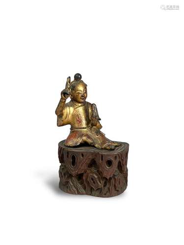 A Bronze seated Boy, 17th century