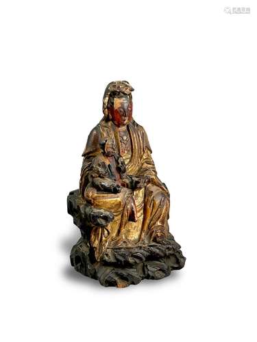 A lacquered wood Guanyin group, 17th century