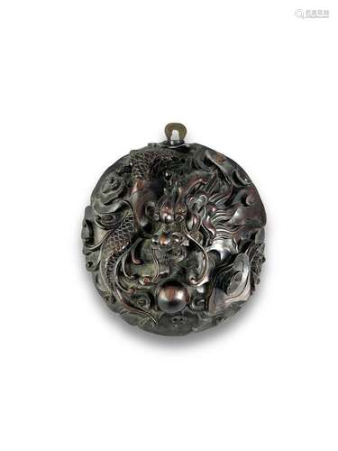 A Carved blackwood Dragon Roundel, 19th century