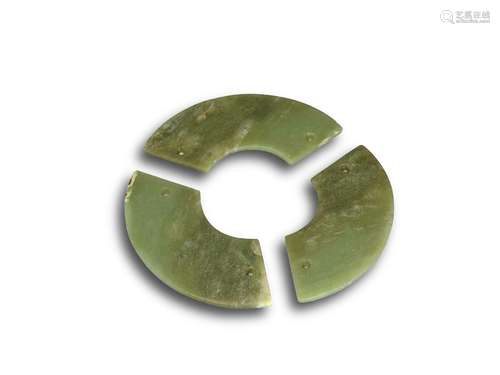 A three-part celadon and russet jade disc, Neolithic period