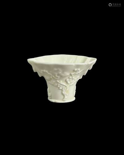 A 'blanc de chine' prunus libation cup, Kangxi