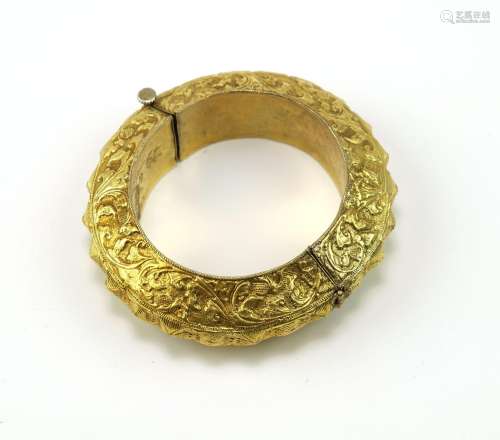 A gold Minangkabau repousse bracelet from Sumatra