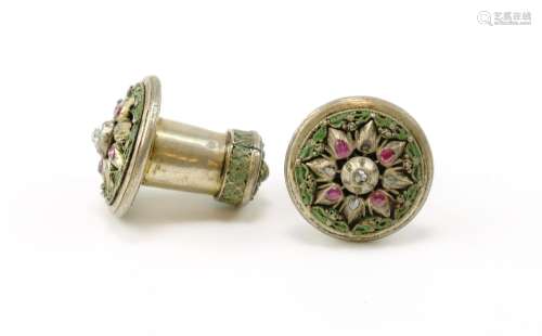 A pair of silver ornate earrings