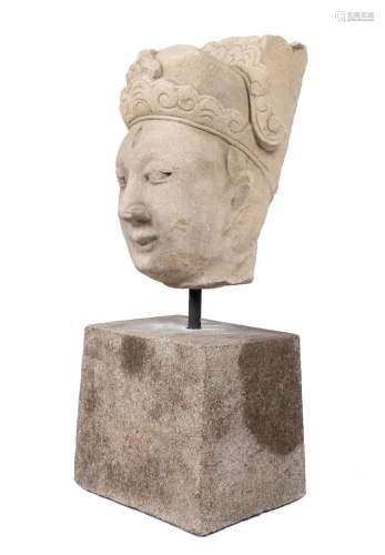 A large carved sand stone head of a dignitary