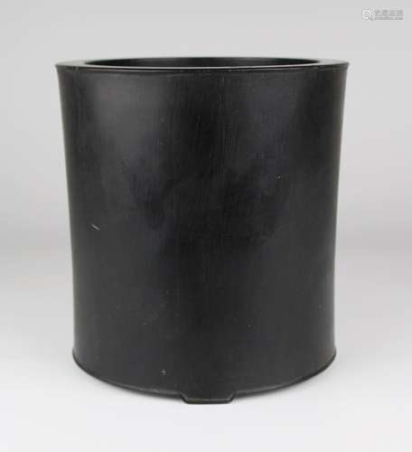 A large wooden brush pot