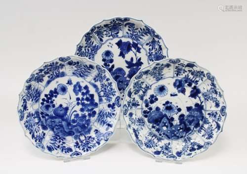 Three small blue and white floral plates