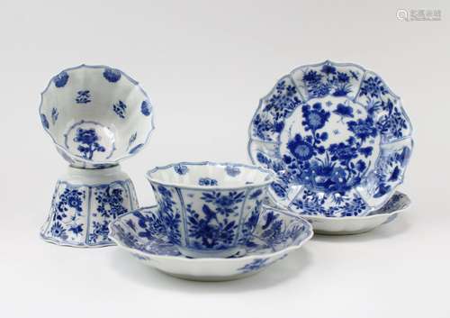 Three blue and white cups and saucers