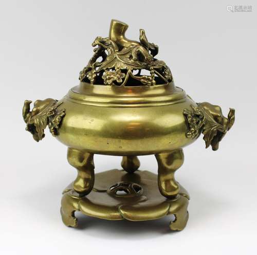 A polished bronze censer with open worked lid