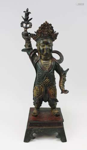 A bronze figure of a Heavenly King