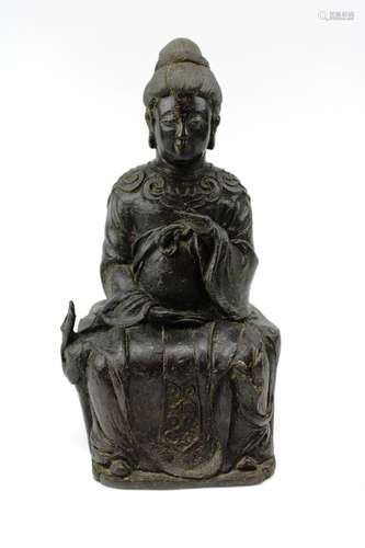 A bronze figure of a seated lady