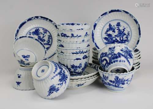 Twelve blue and white cups and saucers