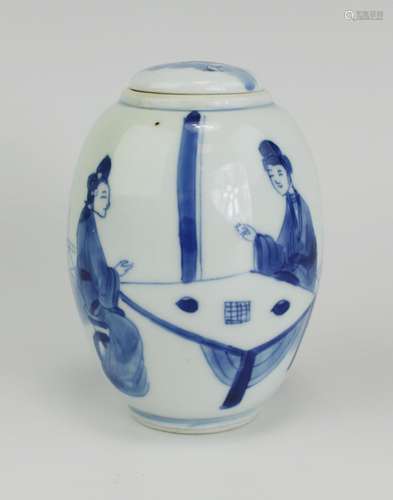 A small ovoid blue and white tea canister