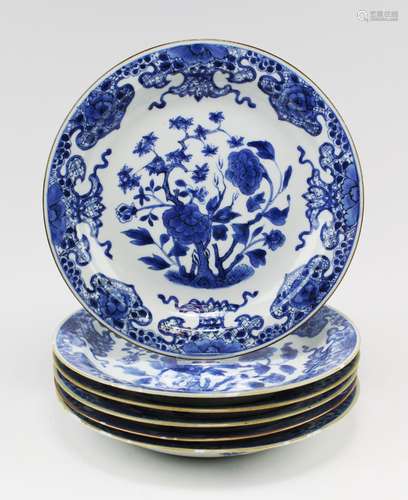 Six blue and white floral plates with brown trim