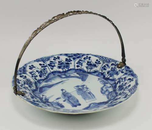 A blue and white plate with Dutch silver handle