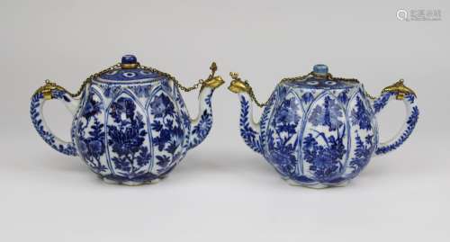A pair of blue and white lotus teapots