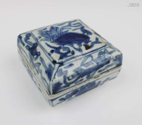 A small square lidded blue and white box