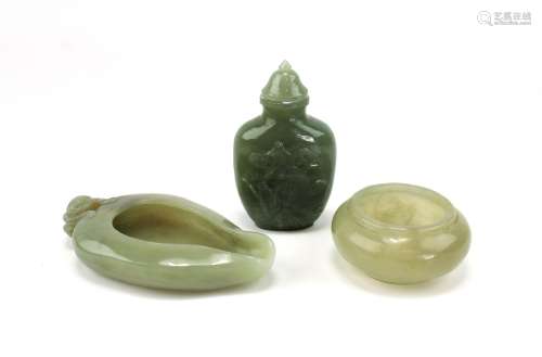 Three pieces of celadon jade (two washers and one snuff bott...
