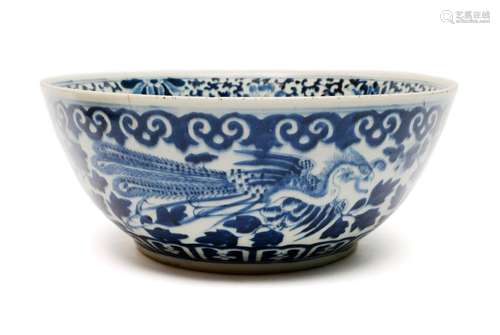 A large blue and white dragon and phoenix bowl