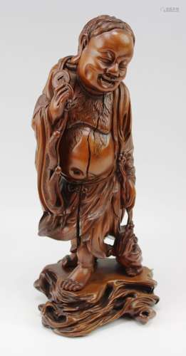 A carved wooden figure of Liuhai