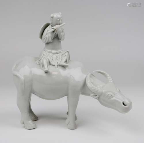 A blanc-de-chine porcelain figure of a boy on an oxen