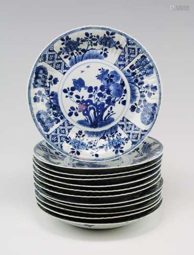 Twelve large blue and white plates