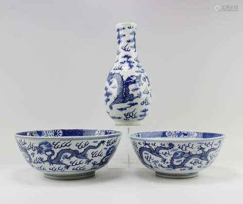 Two blue and white dragon bowls and a vase