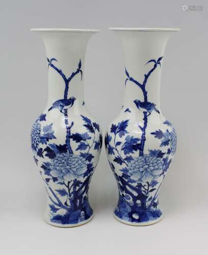 A pair of blue and white vases, birds and florals