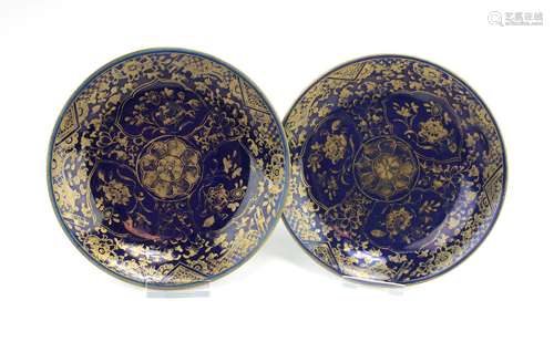 A pair of small blue ground gilt-decorated dishes