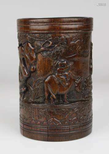 A Chinese bamboo brush pot with relief decoration