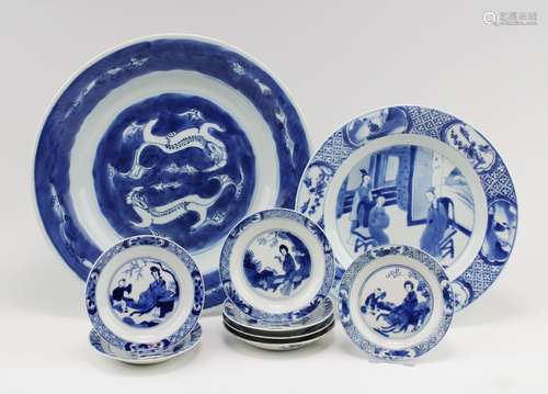 A group of various blue and white plates