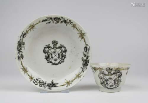 A grisaille chine-de-commande armorial cup and saucer