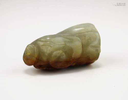 A carved russet jade lotus pod and lingzhi pendant