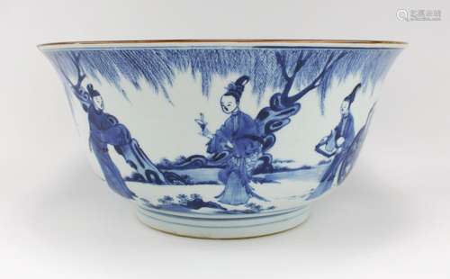 A large blue and white bowl with figures