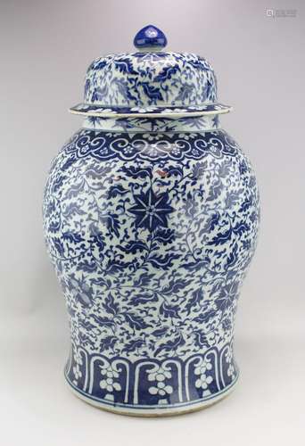 A large blue and white covered baluster vase