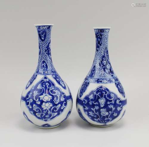 Two pear-shaped blue and white vases