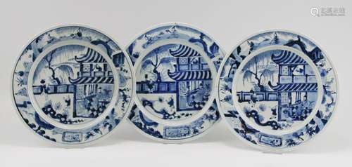 Three blue and white plates