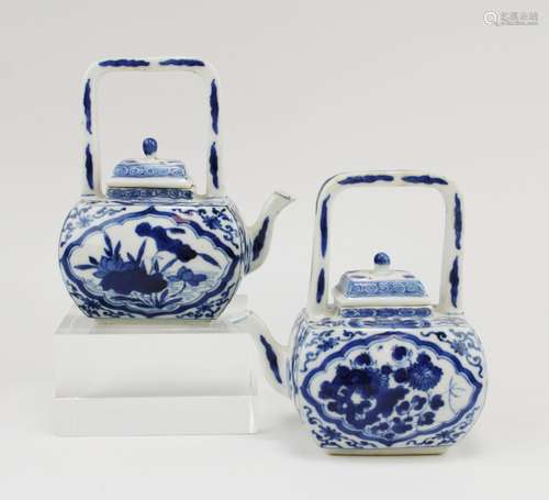 A pair of blue and white small teapots