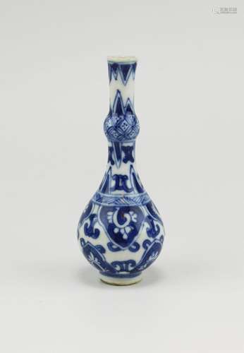 A miniature blue and white bottle vase