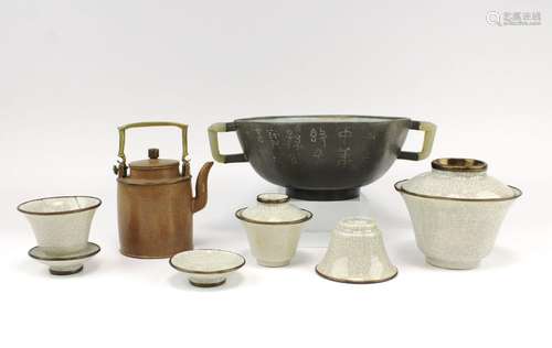 An polished Yixing-type teapot and bowl with a group of lidd...