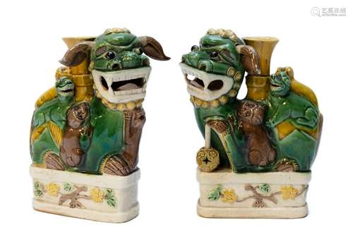 A pair of figural foo-dogs sancai biscuit-ware joss stick ho...