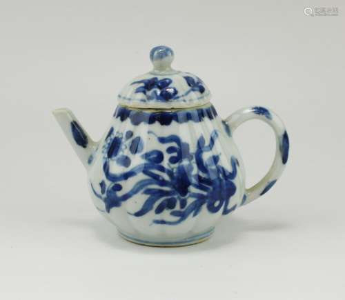 A small blue and white floral teapot
