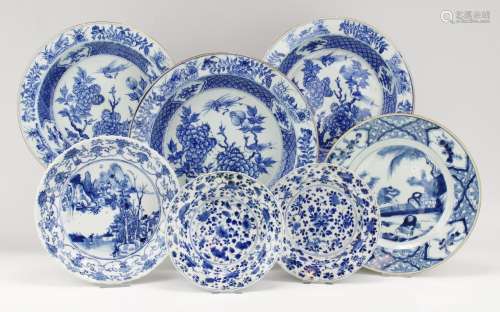 Seven blue and white plates