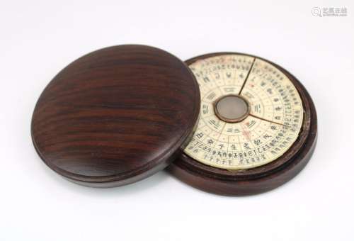 A rosewood and bone compass