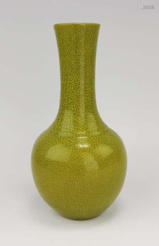 A greenish-yellow crackle-glazed vase